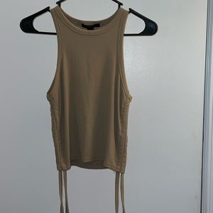Tan tank top from H&M. Has strings on side to make it shorter or longer